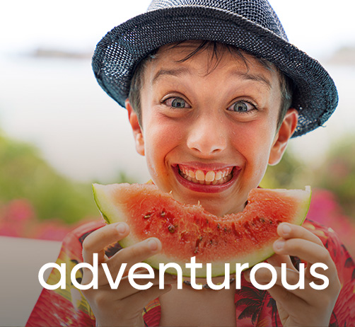 happy child eating a slice of watermelon